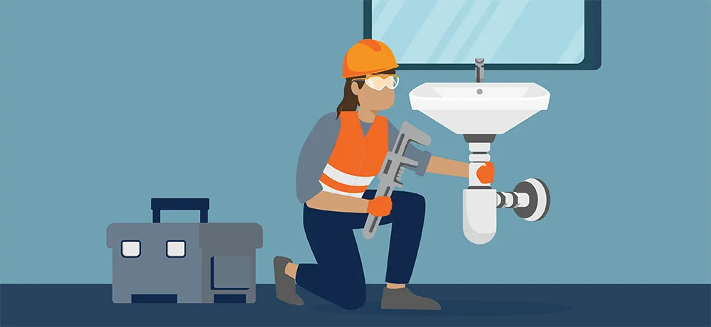 A binder and smartphone with repair photos represent preparing to hire reliable plumbers.